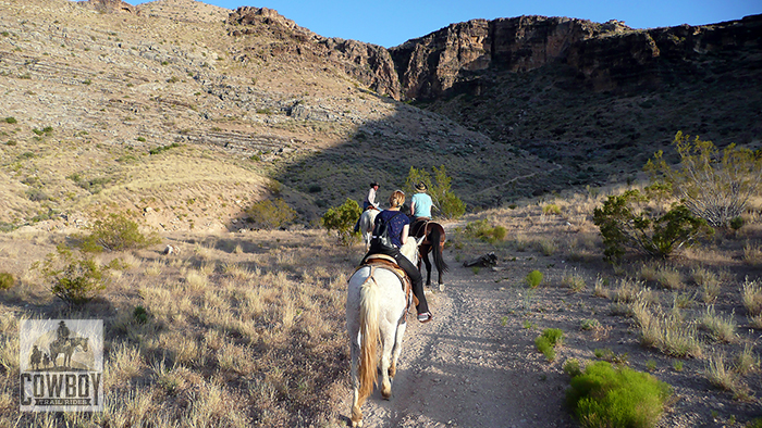Picture of riders leaving the picture stop on the BBQ Sunset Ride while Horseback Riding in Las Vegas at Cowboy Trail Rides in Red Rock Canyon